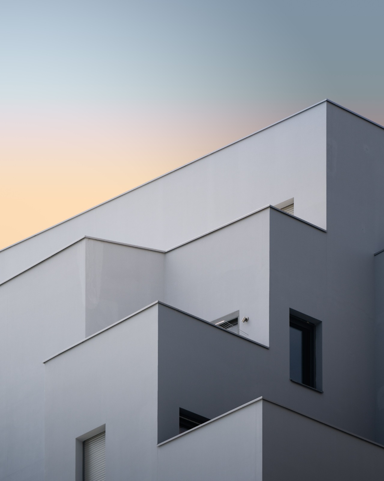 Minimalist apartment-style facade with sharp geometric lines
